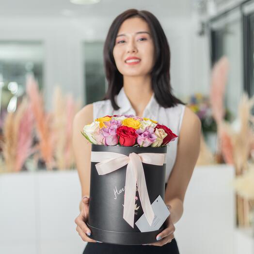 25 mixed roses in a black box