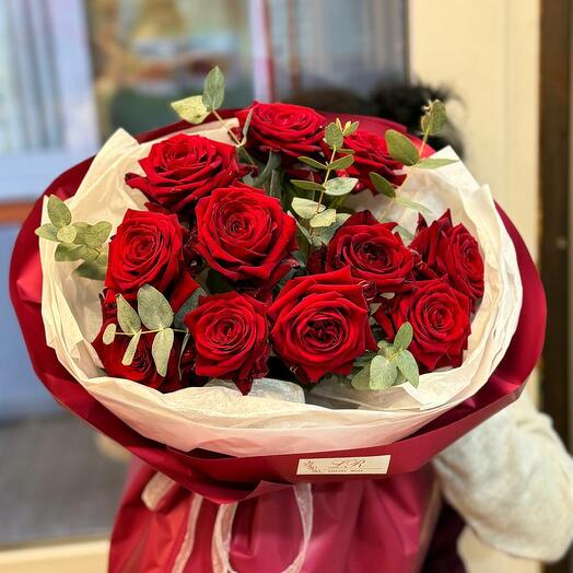 Bouquet of red roses and eucalyptus