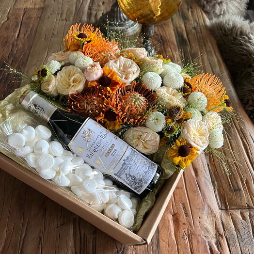 Bright box with flowers and wine