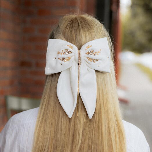 A velvet bow embroidered with beads