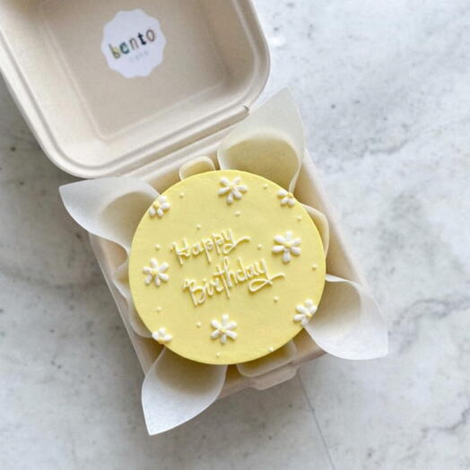 Yellow Butter cake with white flowers