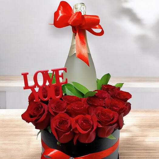Box of red roses and champagne