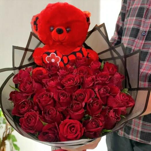 Red roses bouquet with toys