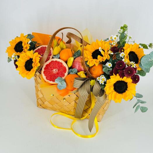 Basket bag with flowers sunflowers and fruits