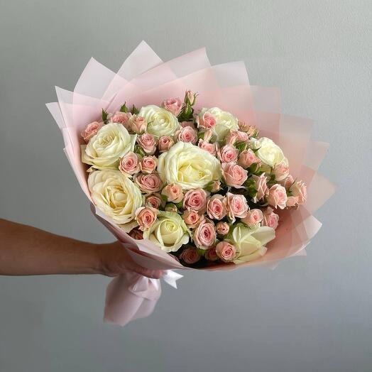 A delicate bouquet of 17 bushy and single-headed roses in a pink package