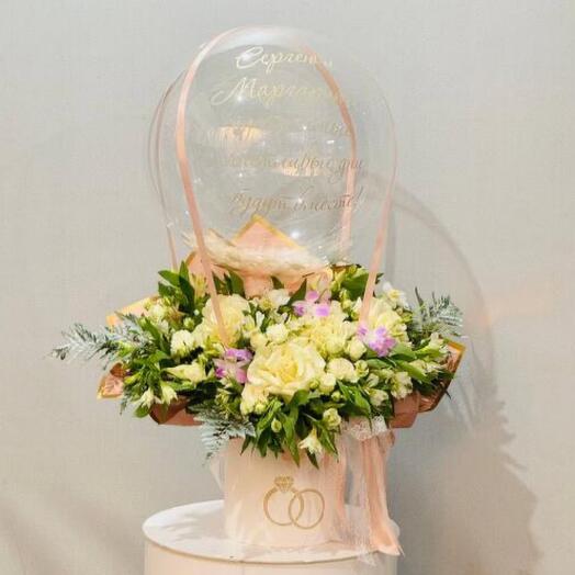 Wedding bouquet of flowers with bubbles balloon as a wedding gift
