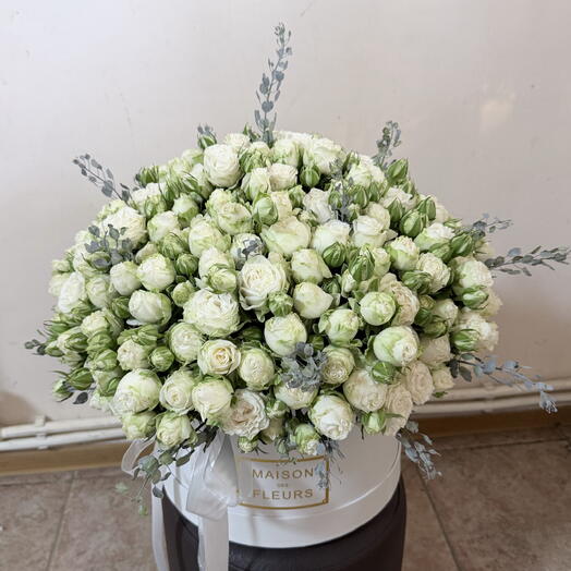 White peony shaped roses in a box