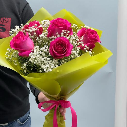 Bouquet of pink roses with gypsophila