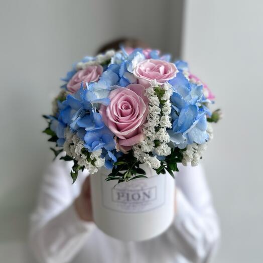 Flowers in a box with blue hydrangea and pink roses