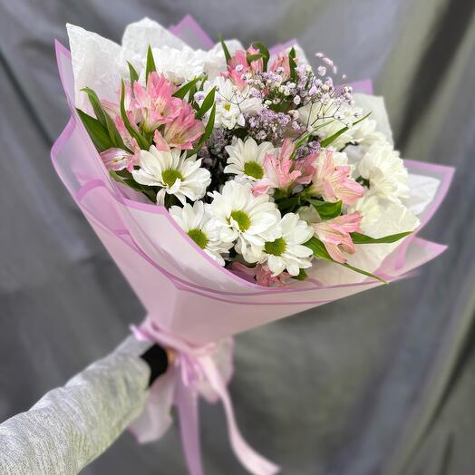 Bouquet of flowers: daisies, pink alstroemeria, gypsophila