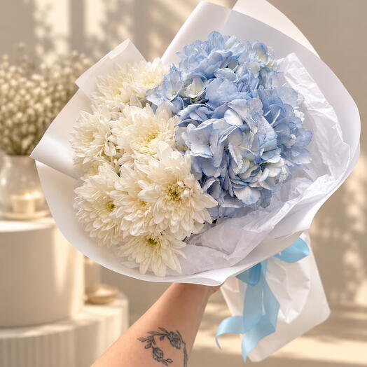 Delicate bouquet of blue hydrangea and white chrysanthemum
