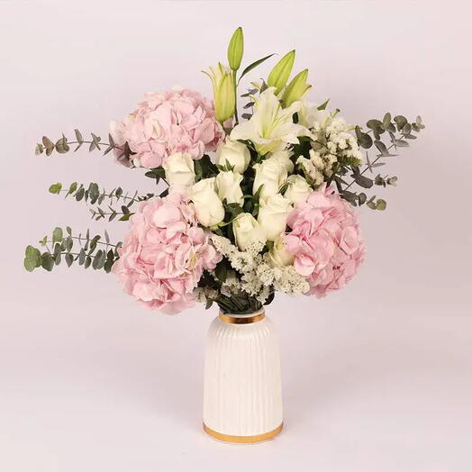 Blooms of Affection in Premium Ceramic Vase: Pink Hydrangeas, White Roses, Oriental Lilies, Statice, Baby Blue Eucalyptus