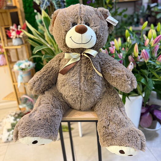 Мягкий медведь с бантом