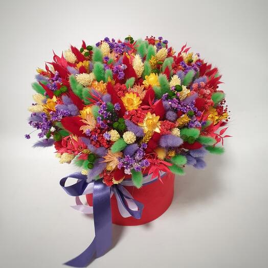 Colorful bouquet of dried flowers in a hatbox