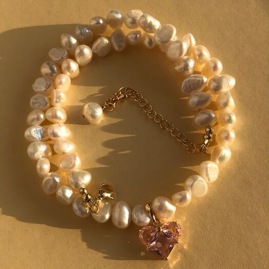 Necklace made of natural Baroque pearls with a cubic zirconia heart pendant, pale pink