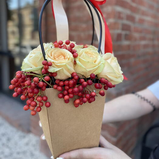 Rose with viburnum in a craft bag