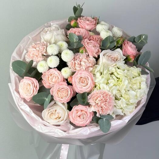 Delicate bouquet with peony-shaped roses and white hydrangea
