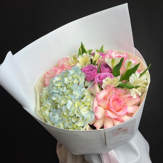 Bouquet of delicate openwork roses, blue hydrangeas and alstroemeria