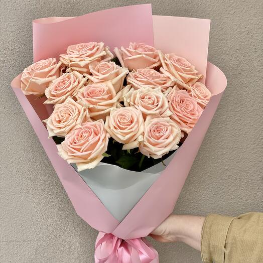 A bouquet of light pink roses in packaging