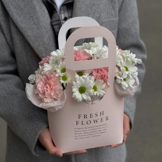 A handbag made of bush chrysanthemums daisies and delicate dianthuses