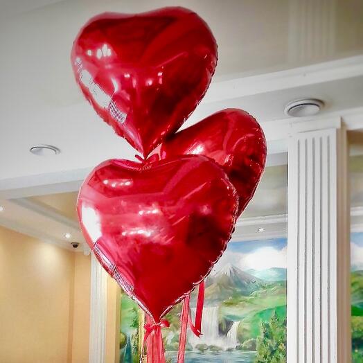 3 large red hearts with helium