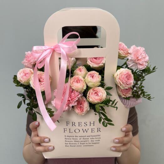 Stylish handbag made of bushy peony rose and bush dianthus