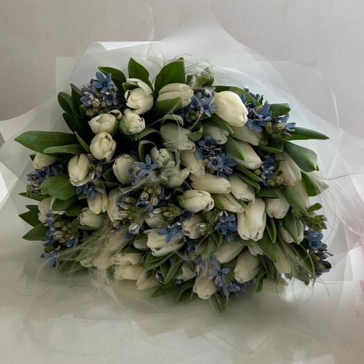 Bouquet of white tulips, blue oxypetallum and stifa
