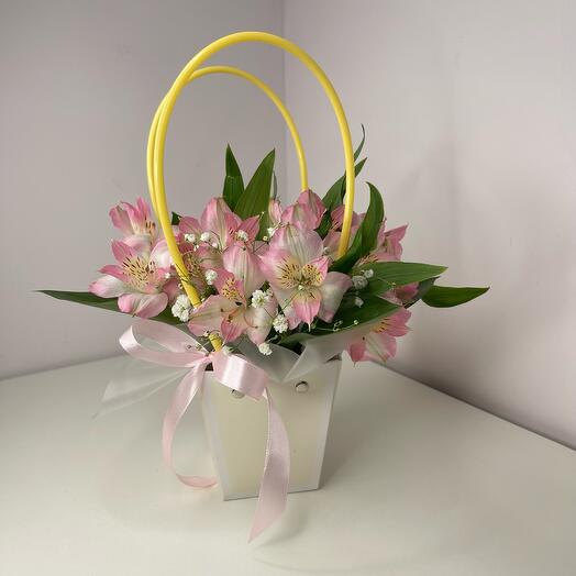 Flowers in a box. Alstroemeria pink with gypsophila