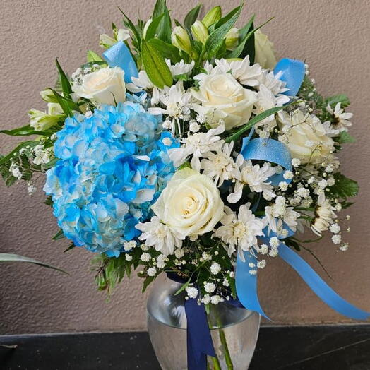 Blissful Arrangement :3 White lilies ,6 White Rose,6 White Astromeria ,6 White Chrysanthemum and 1 Blue Hydrangea