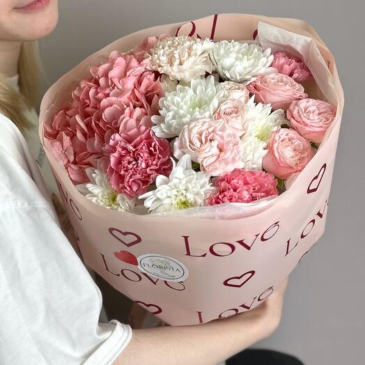 Delicate bouquet with hydrangea, peony-shaped roses and dianthus
