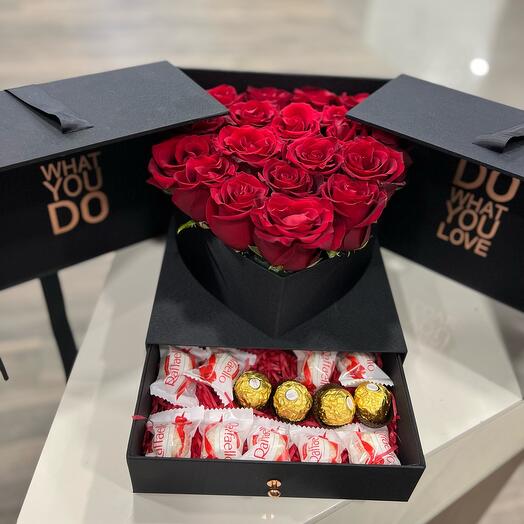 Box with red rose and chocolate