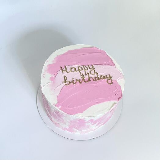 A cake with a golden inscription
