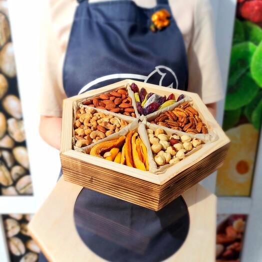 Wooden box with nuts and dried fruits