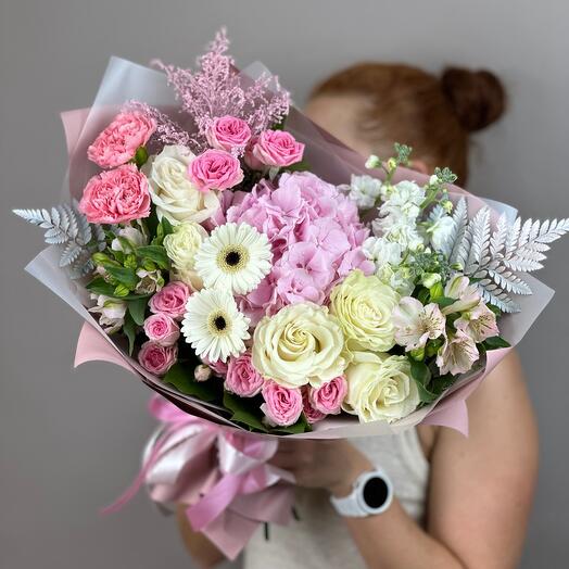 An air kiss bouquet of white roses and hydrangeas