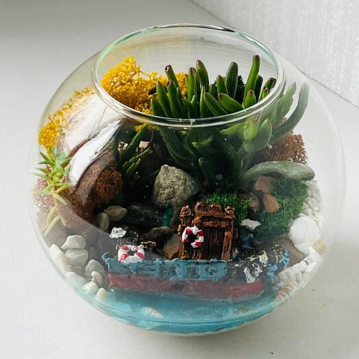 Florarium with fresh flowers and a sunken ancient ship