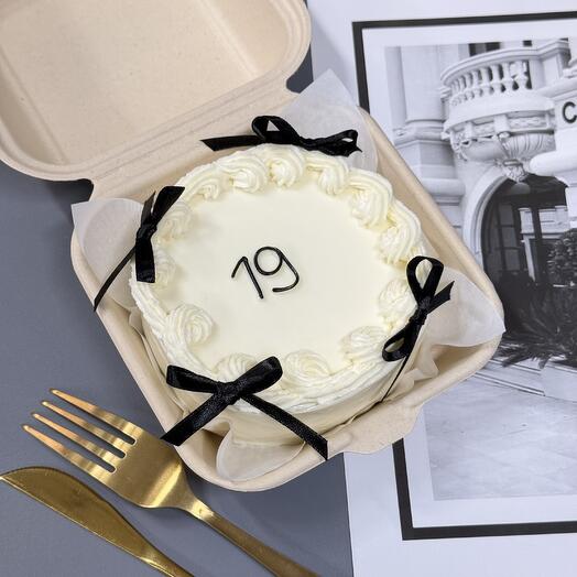 Bento cake with black bows and ruffles for birthday