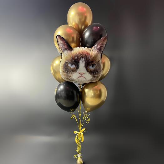 Balloons are gold and black, for birthday