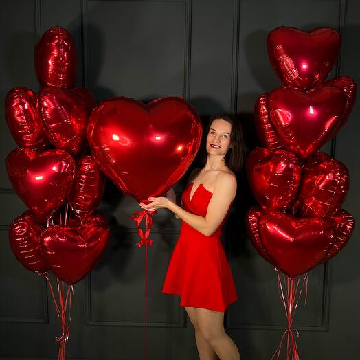 Composition of helium balloons hearts with a big heart