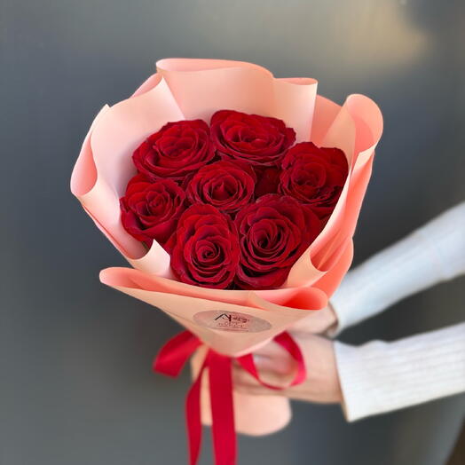7 roses in a package from a florist