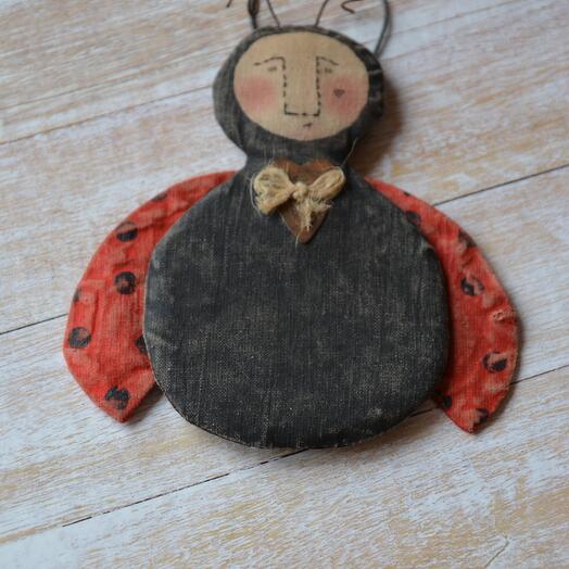 Primitive ladybug-suspension