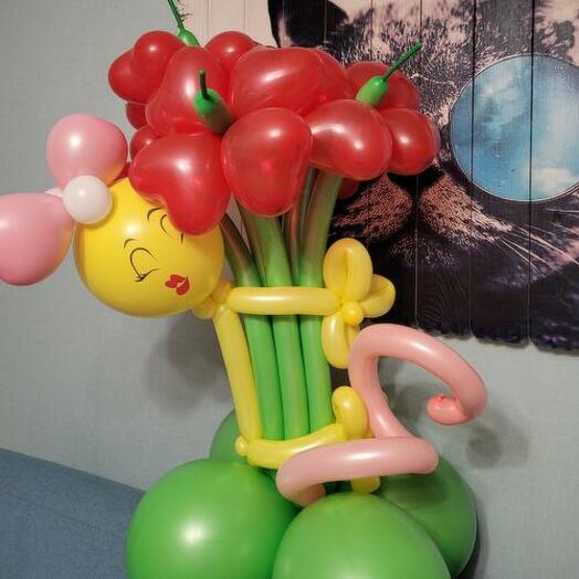 A bouquet with a funny girl and red daisies