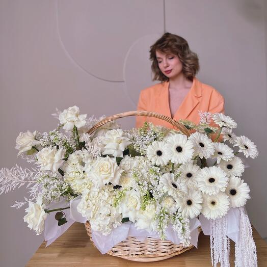 Gorgeous lush snow-white basket with hydrangeas and gerbera