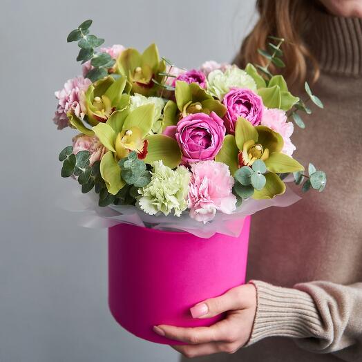 Peony roses and pistachio orchids in a box