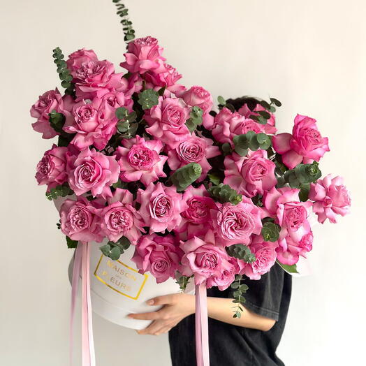 French roses with eucalyptus in box