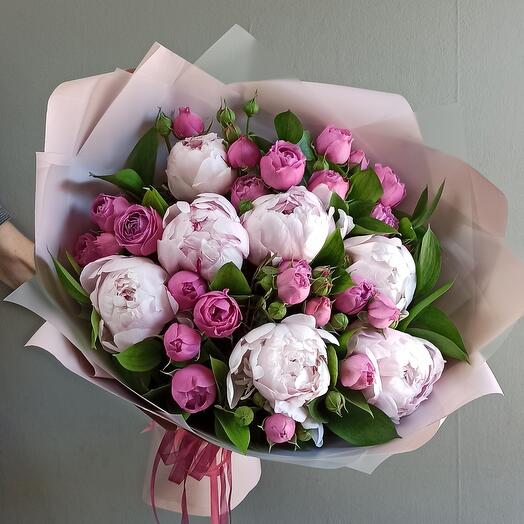 Bouquet of peonies, peony-shaped roses and greenery