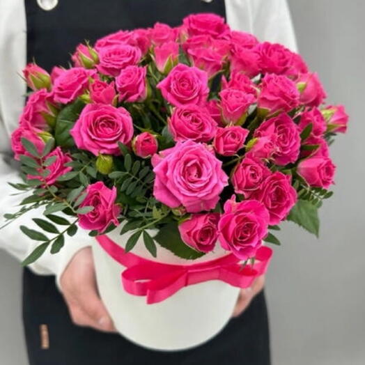 Pink bushy roses in a box