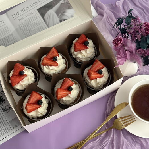 Set of cupcakes with berry decoration