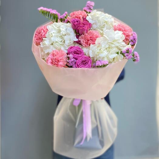 A round bouquet of gorgeous Hydrangeas and bushy Peony-shaped Roses