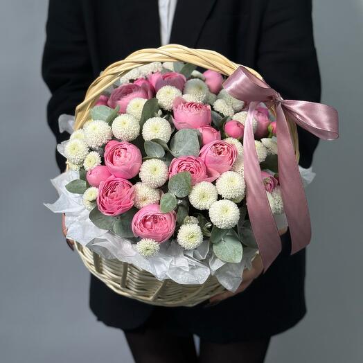 Basket with peony roses and spray chrysanthemums