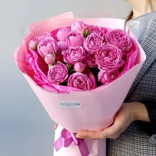 A compliment bouquet of peony-shaped bush roses